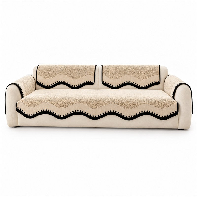 Scalloped chenille sofa cover in black coffee with contrast trim on a white studio background